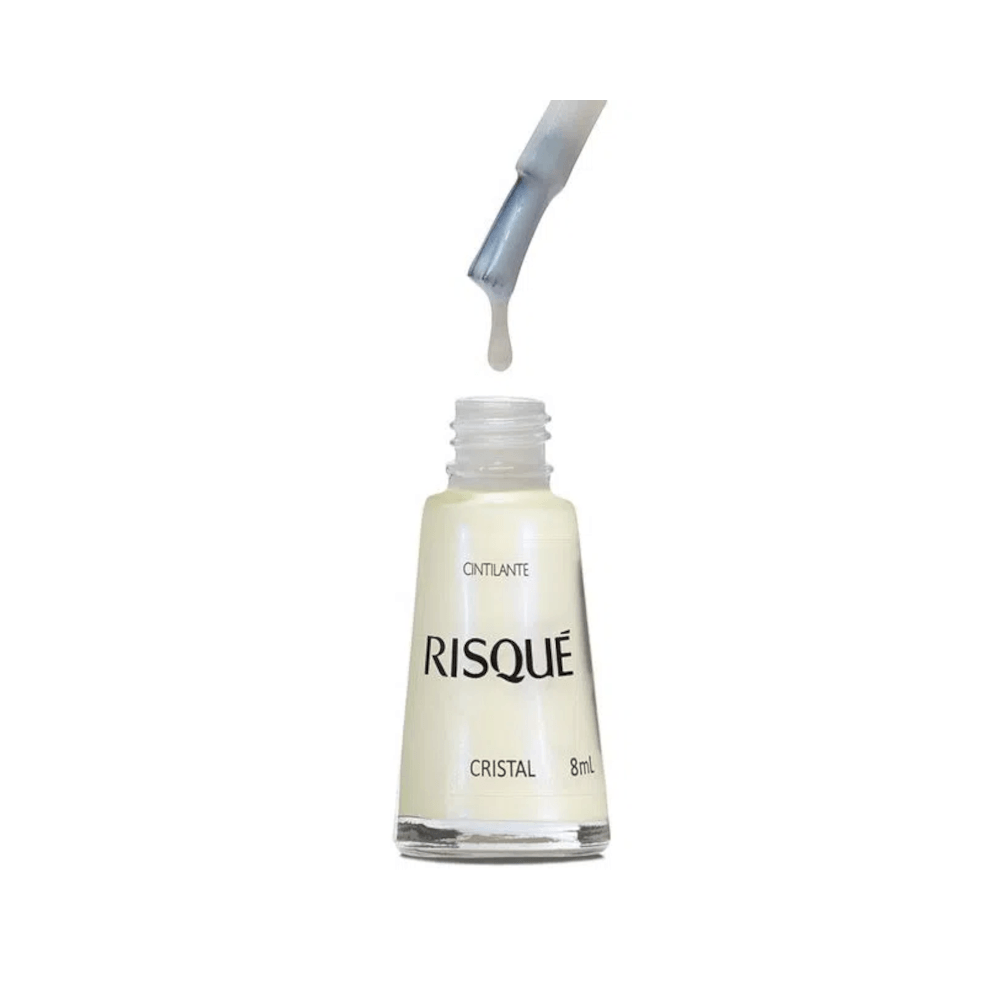 Frasco aberto com pincel e gota do esmalte branco perolado