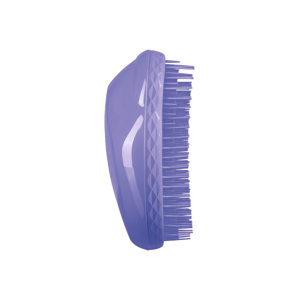 Vista lateral da escova Tangle Teezer The Original Thick & Curly violeta mostrando cerdas e corpo curvo