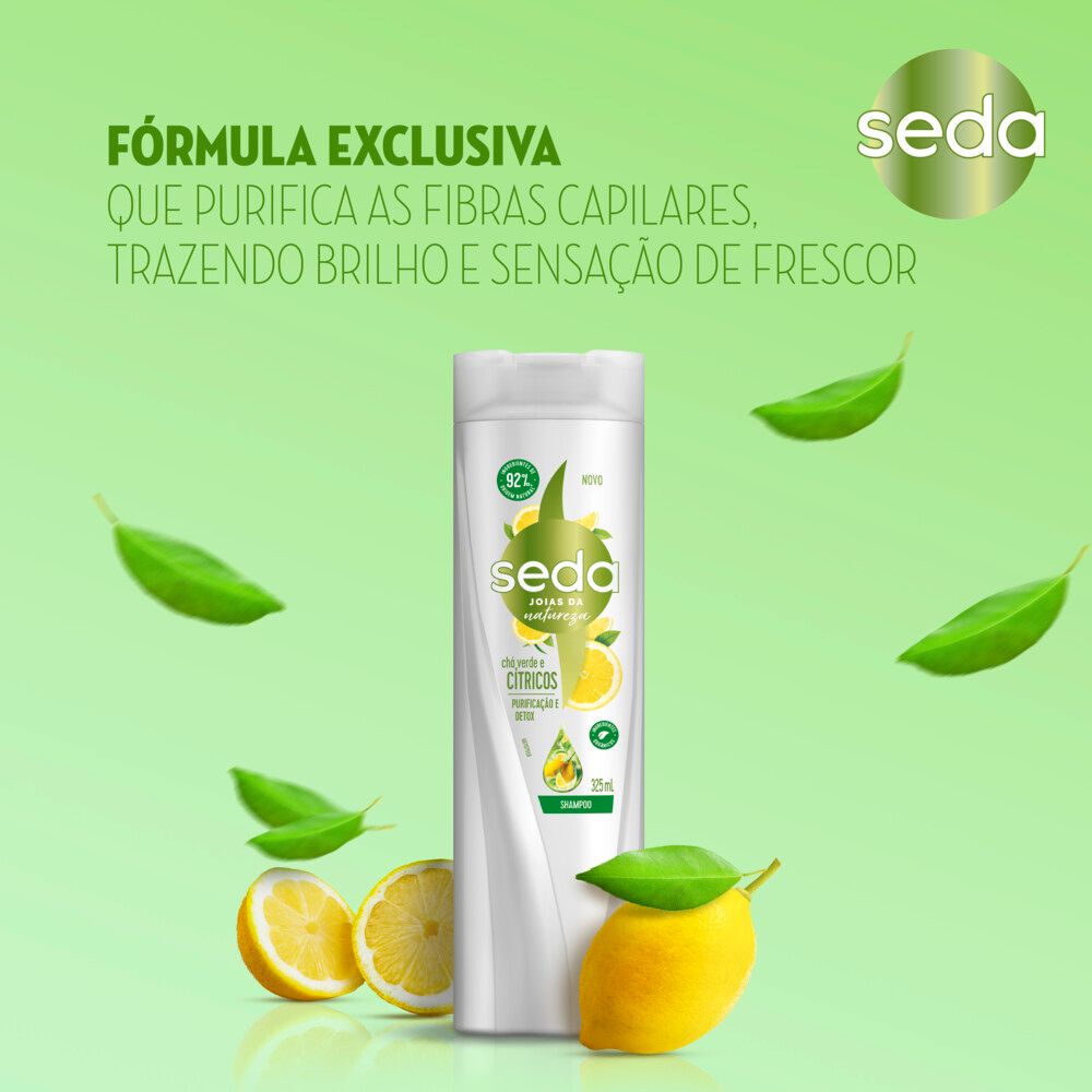 Promoção visual do frasco rodeado por folhas verdes e limões destacando purificação e frescor