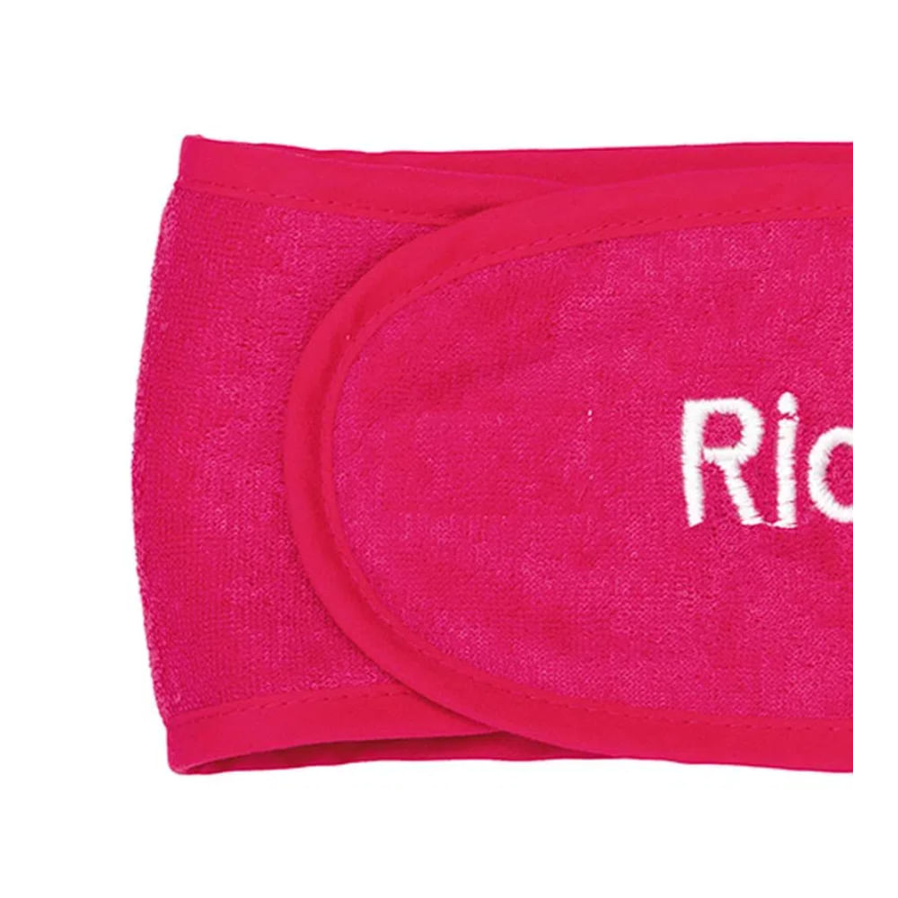 Close da Faixa Ricca mostrando textura atoalhada, velcro e costura reforçada