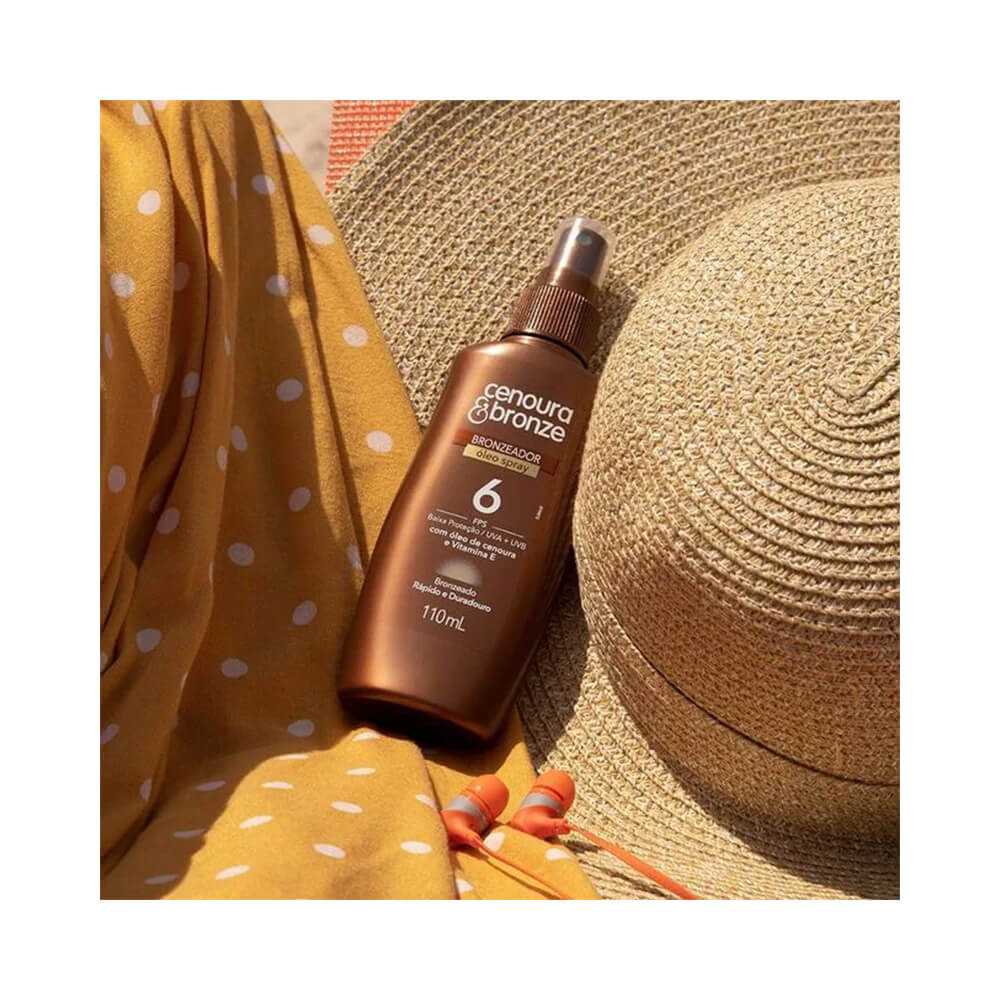 Frasco do óleo bronzeador Cenoura e Bronze FPS 6 em ambiente ensolarado com acessórios de praia