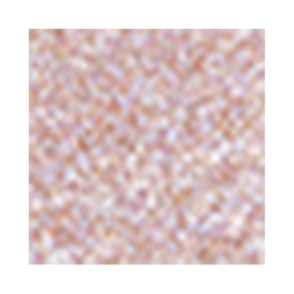 Close da textura perolada rosa claro do iluminador mostrando brilho e efeito cintilante