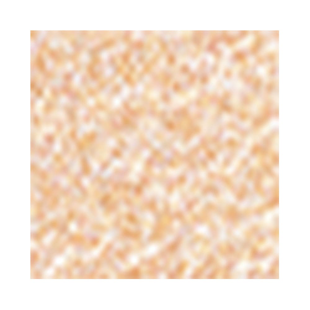 Close da textura dourada cintilante do iluminador Glow Cake