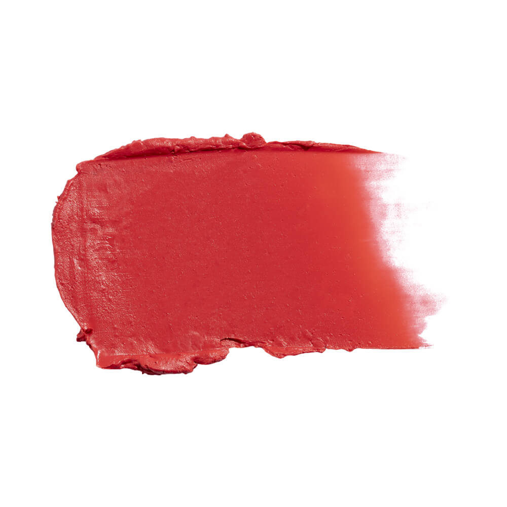 Amostra da textura cremosa e cor coral do blush em stick Ruby Kisses