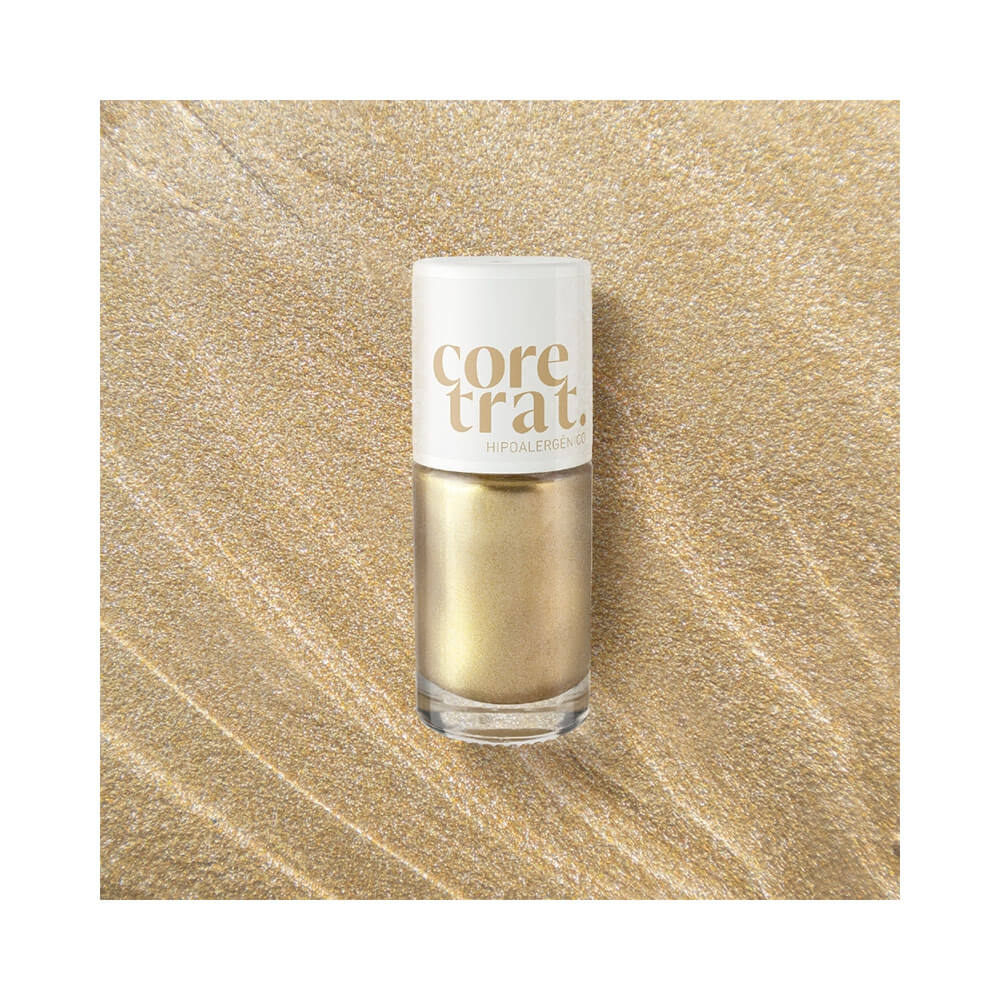 Frasco do esmalte Blant Coretrat sobre fundo dourado texturizado destacando o brilho