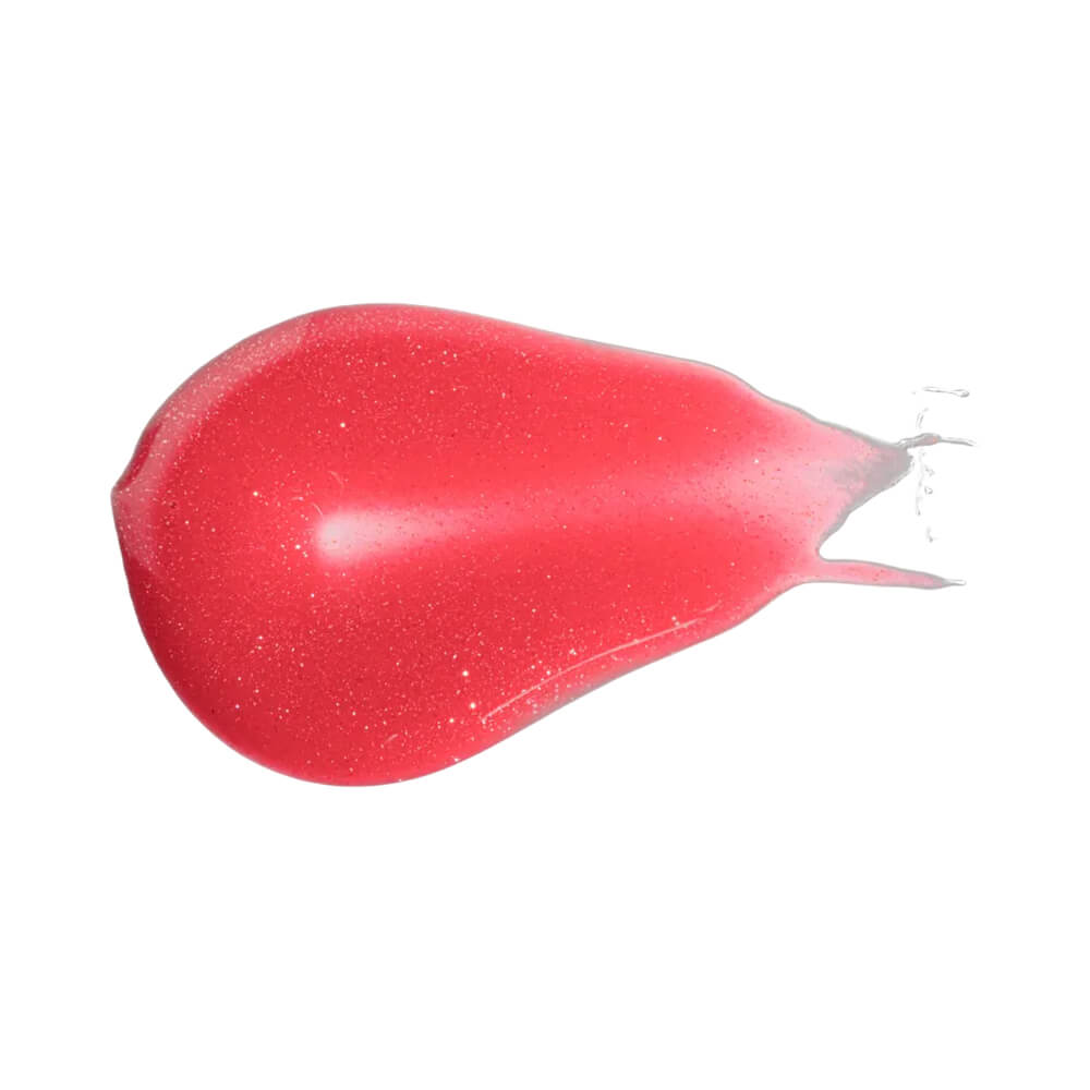 Gota de gloss Bauny Peach Glow mostrando cor e partículas cintilantes