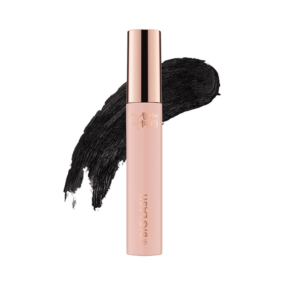 Máscara de Cílios Bruna Tavares Biglash em tubo rosa claro com tampa dourada rosé e textura cremosa preta.