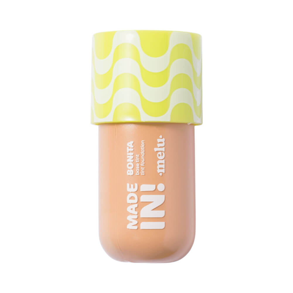 Imagem da base líquida Melu Made In! Foundation Tint na tonalidade 70 com embalagem compacta bege claro e tampa amarela.