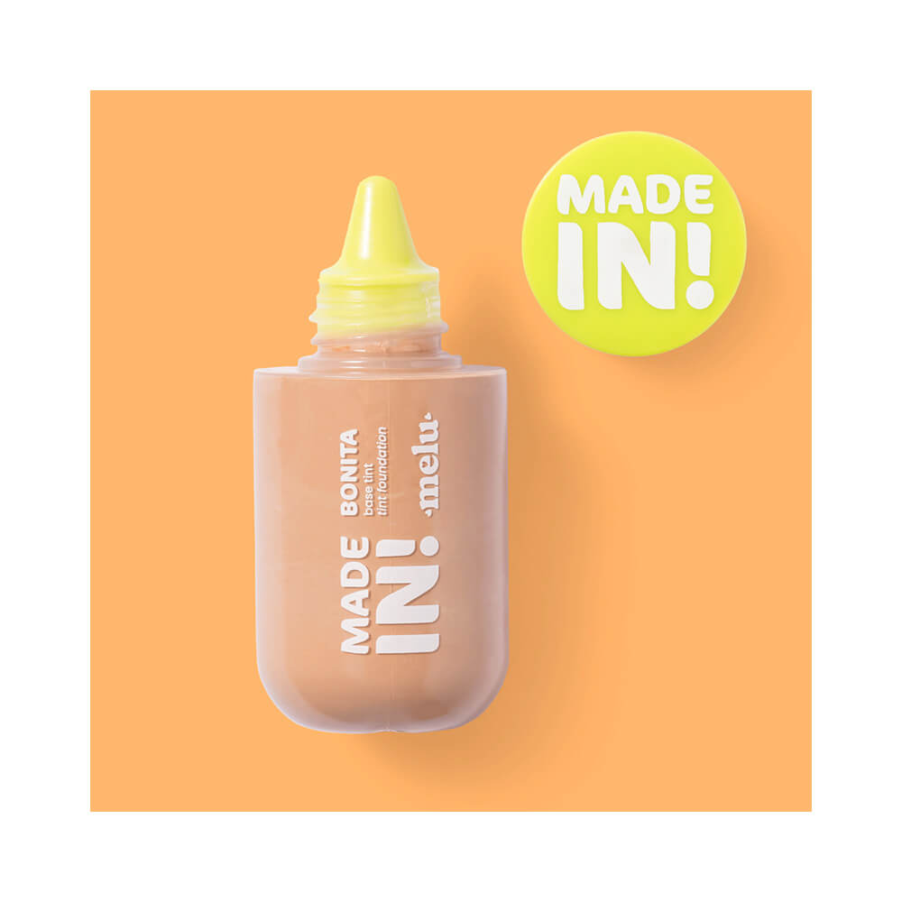 Base Melu com tampa removida mostrando aplicador conta-gotas