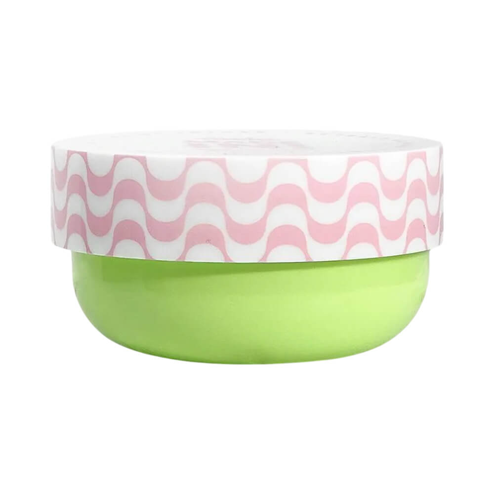 Pote redondo de hidratante facial Melu Made In! Romã da Sorte de 50g, corpo verde claro e tampa branca com padrão rosa