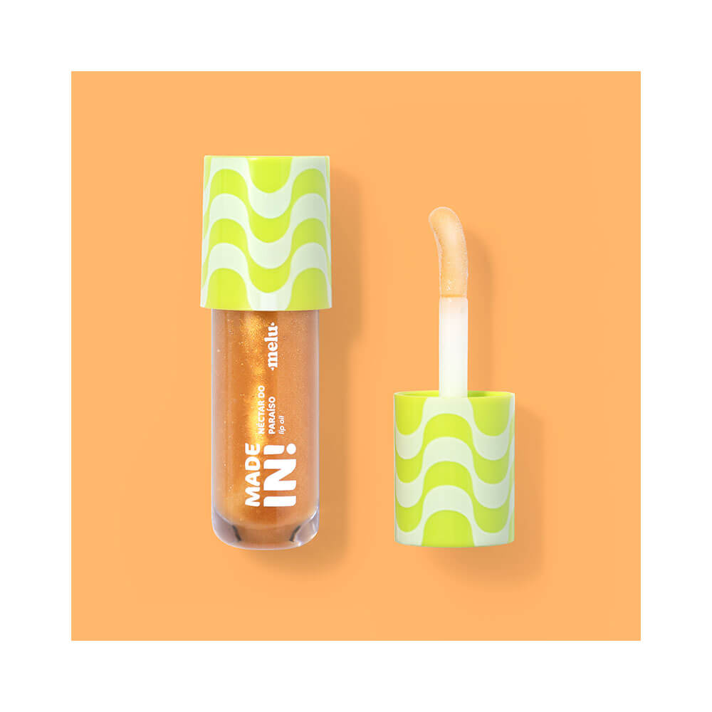 Frasco do Lip Oil Melu Made In! Néctar do Paraíso aberto, mostrando aplicador com óleo labial dourado cintilante.