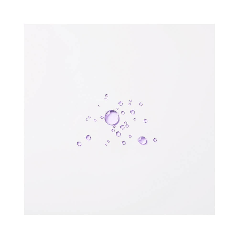 Produto Leave-In Wella Blondorplex 145ml em fundo branco com gotas de líquido lilás