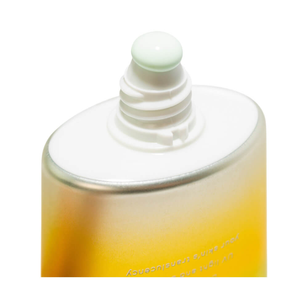 Close do aplicador e textura verde menta do protetor Skin Aqua