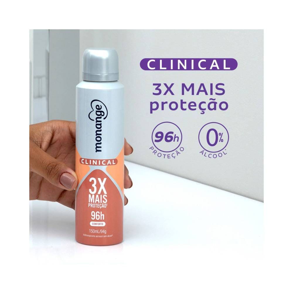 Mão segurando o desodorante Monange Clinical Conforto Aerossol Feminino 150ml
