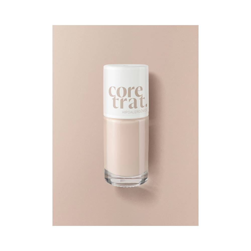 Frasco do esmalte Blant Coretrat Cremoso Pequeno Gesto sobre fundo bege claro