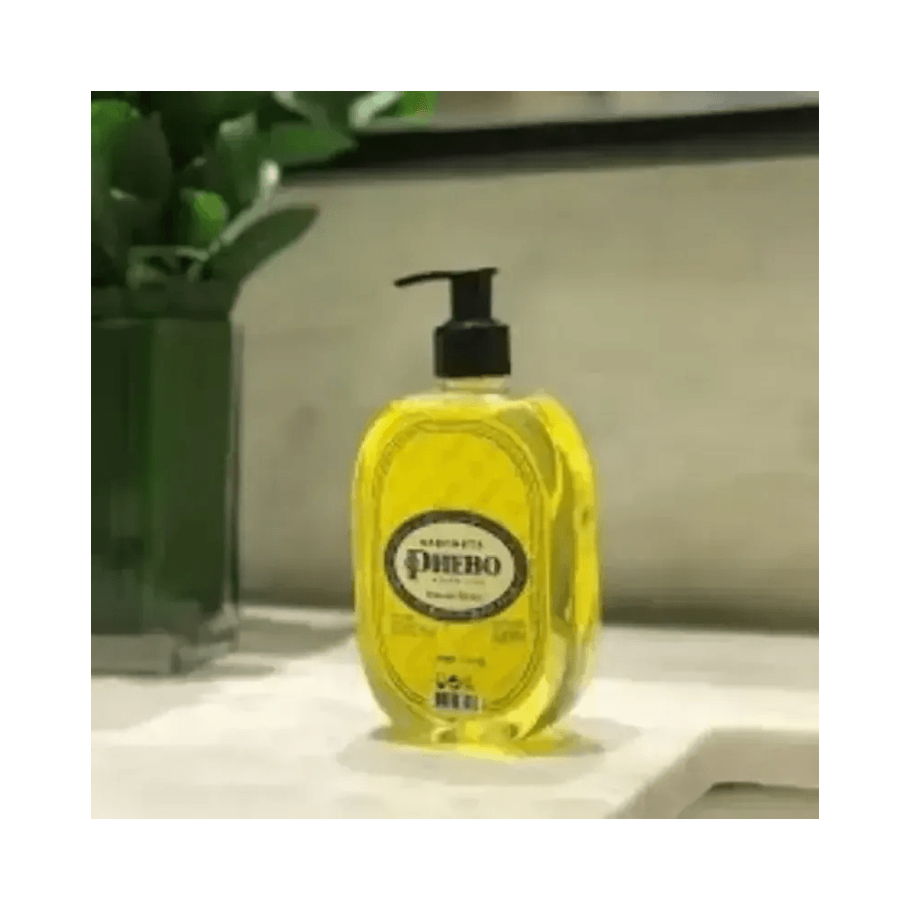 Sabonete Líquido Phebo Lima da Pérsia 320ml em superfície clara com planta ao fundo