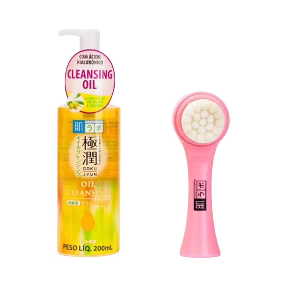 Frasco pump amarelo translúcido do Oil Cleansing ao lado do massageador facial rosa