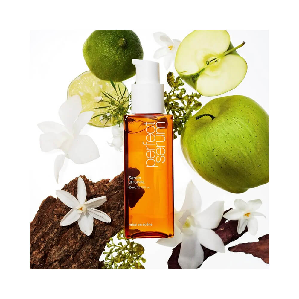 Sérum Capilar Mise en Scène com ingredientes naturais como maçã verde e flores, evidenciando notas aromáticas