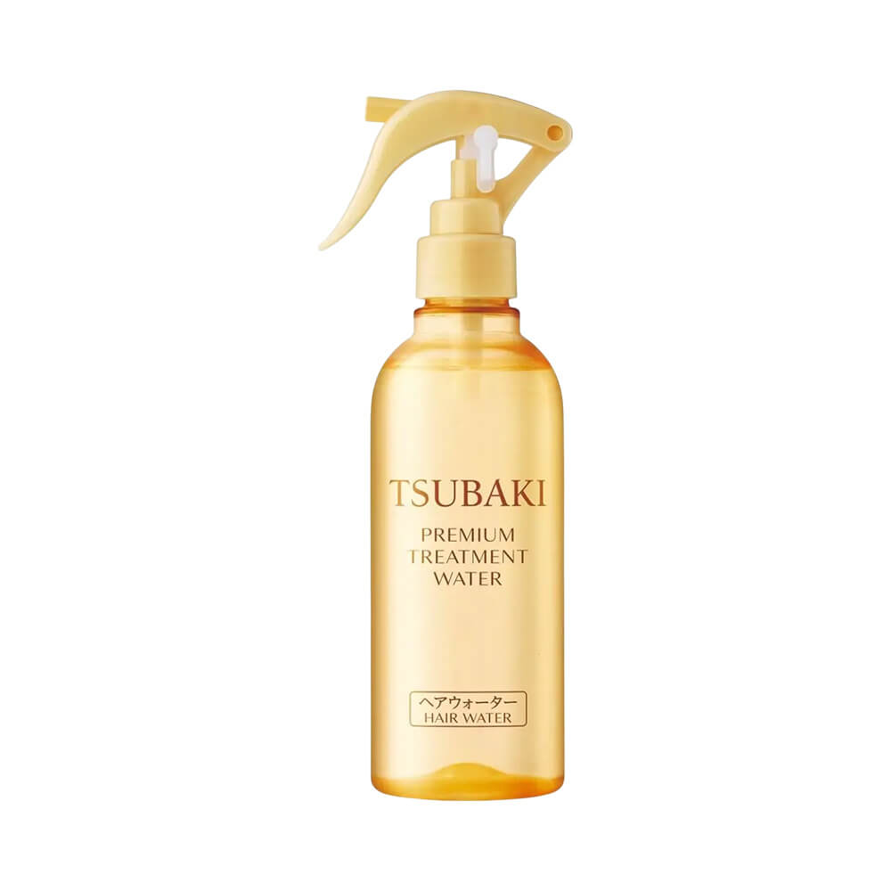 Frasco translúcido dourado com borrifador amarelo claro do Leave-In Tsubaki Premium Treatment Water 210ml