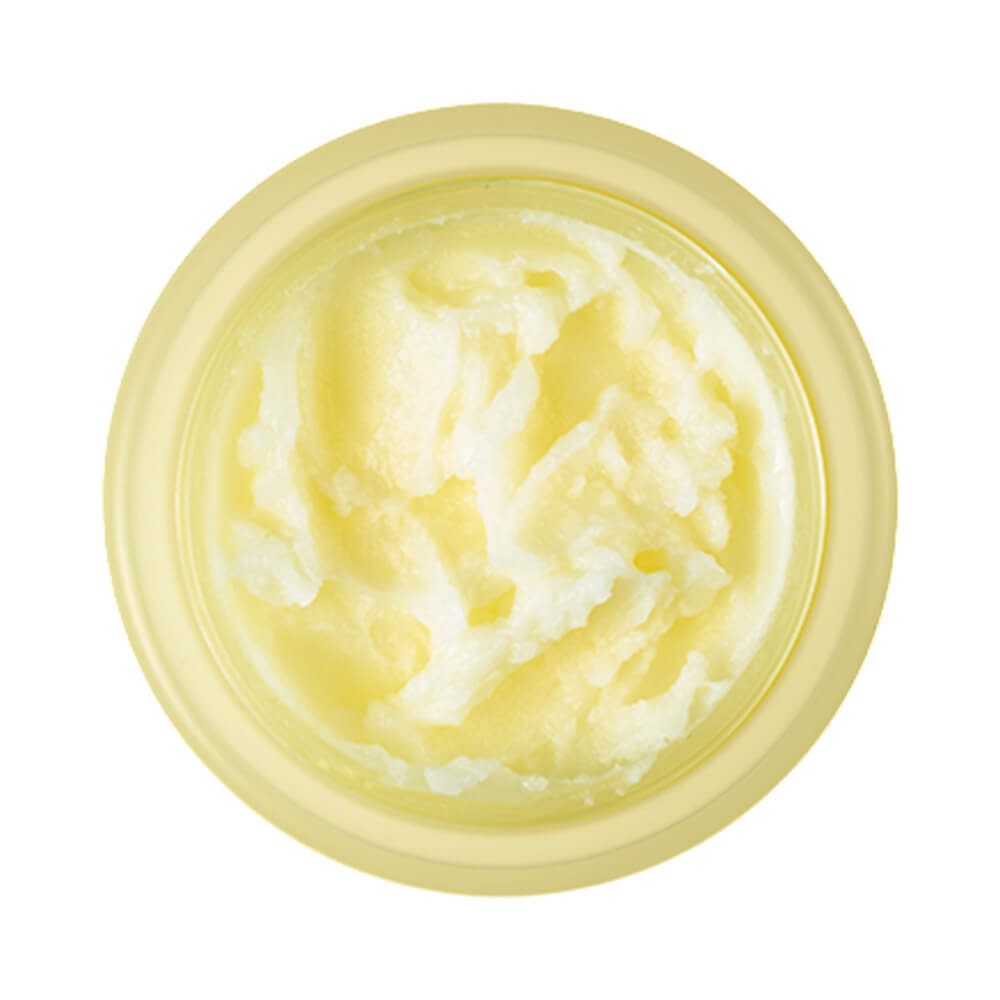 Pote aberto mostrando a textura cremosa e amarelada do balm Banila Co Clean It Zero Nourishing