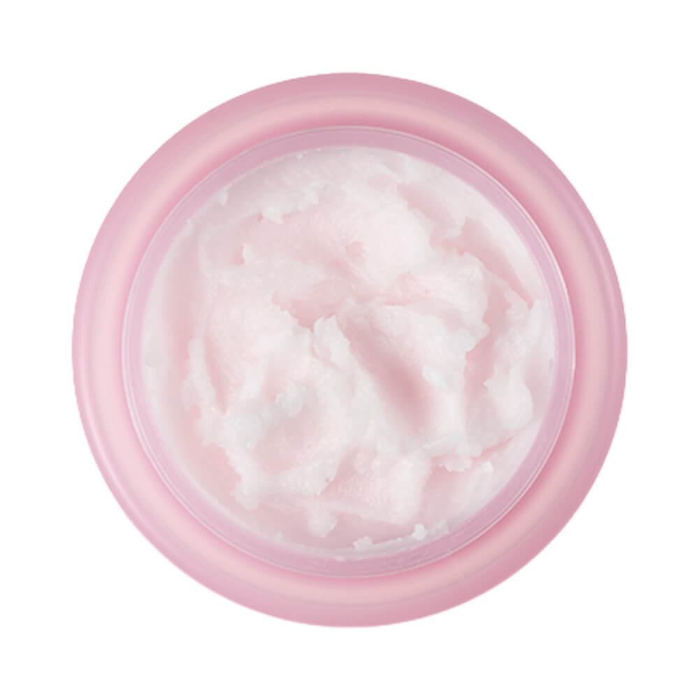 Visão superior do pote rosa claro do Cleansing Balm Banila Co aberto mostrando o balm branco