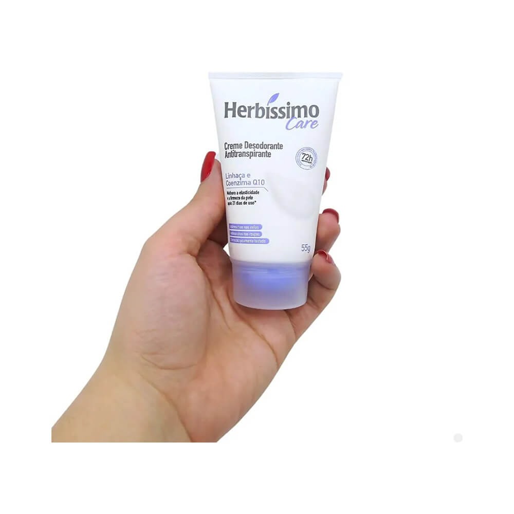 Desodorante Creme Herbissimo Care Linhaça e Coenzima Q10 sendo segurado por mão feminina
