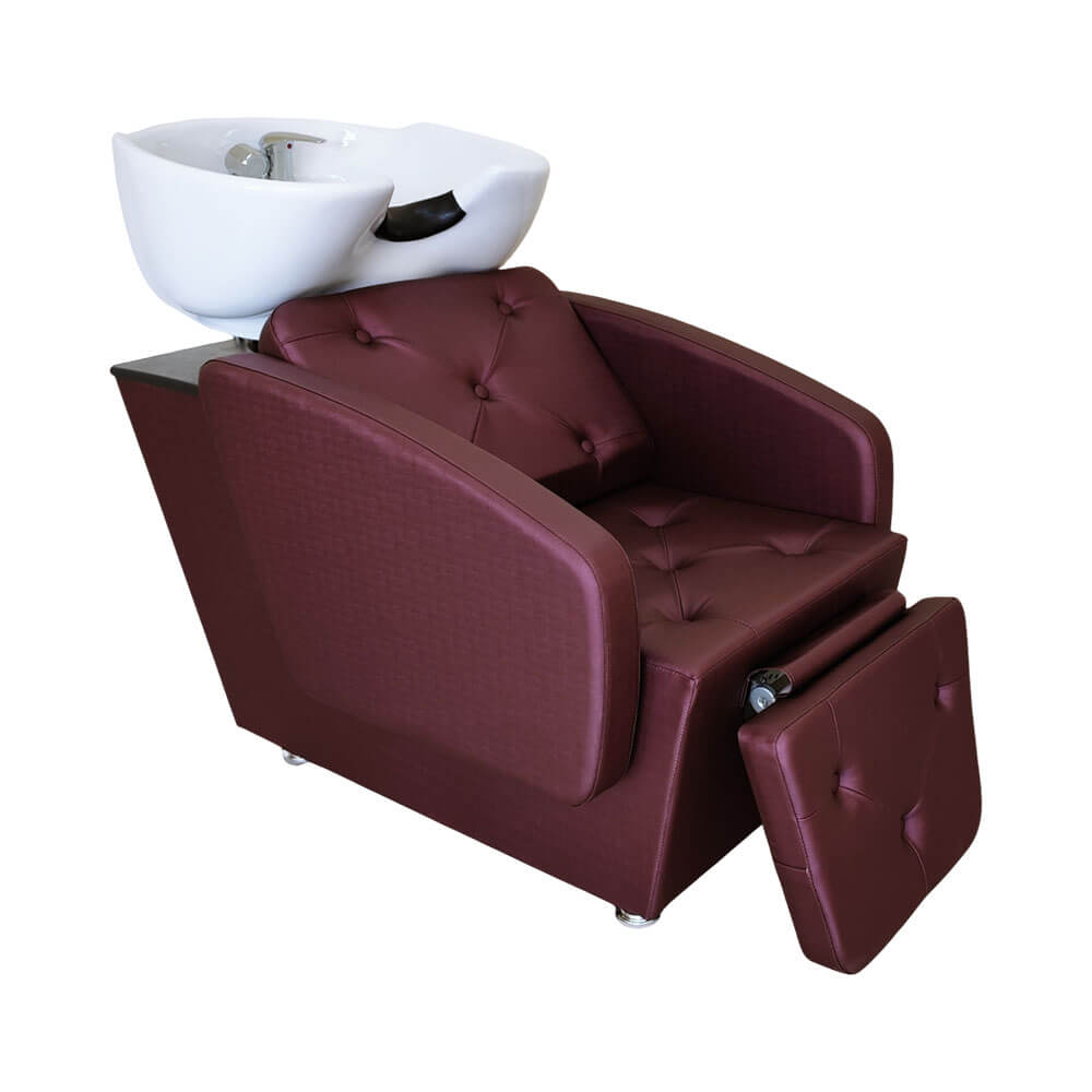 Lavatório Terra Santa Belle com descanso para pernas, cor rosê gold, com assento estofado e cuba móvel em porcelana.