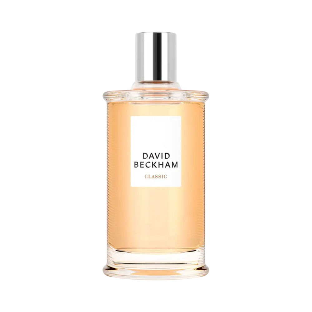 Frasco transparente com líquido âmbar claro, rótulo branco e tampa prateada metálica do Eau De Toilette David Beckham Classic 100ml