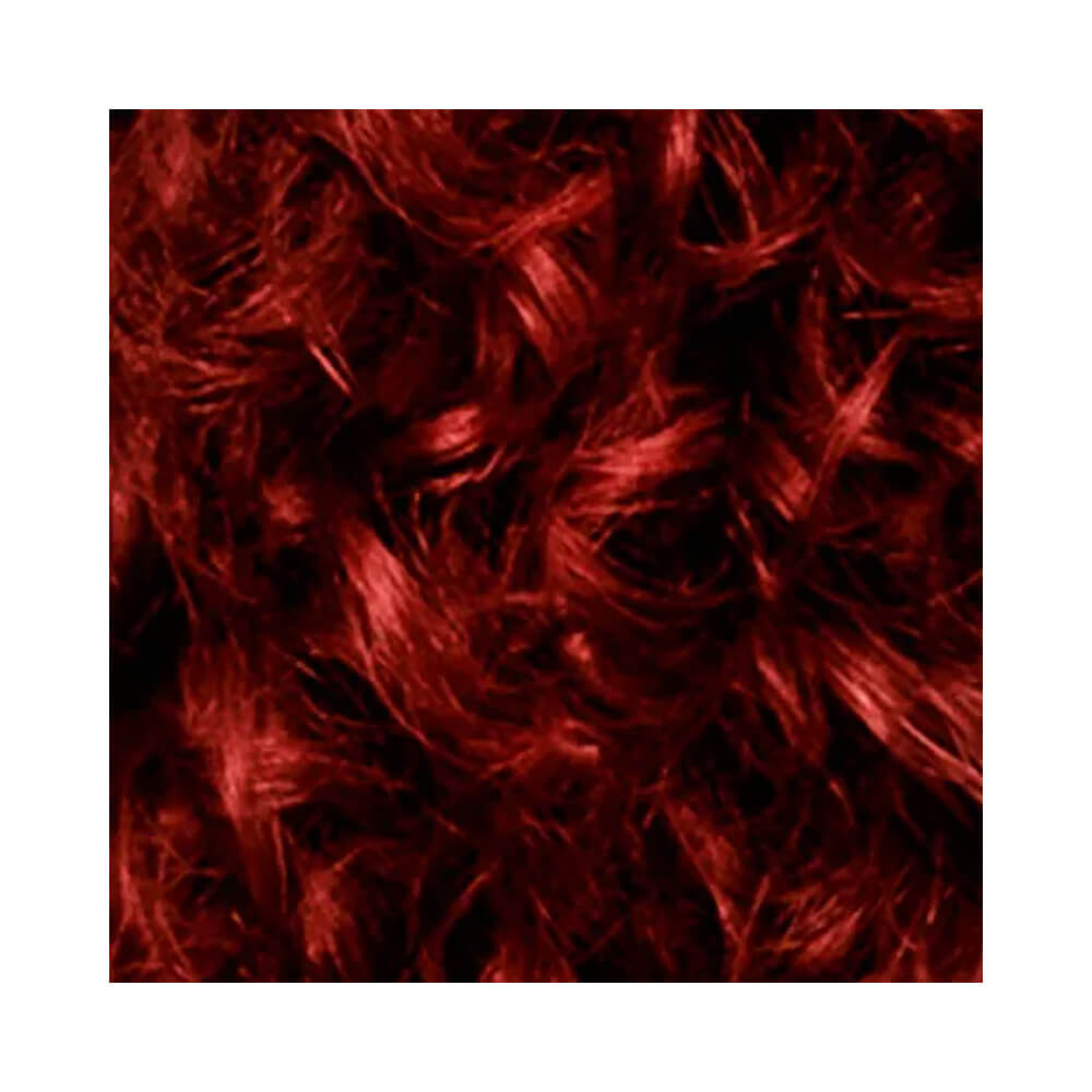 Close no cabelo cacheado com cor vermelha intensa e brilho luminoso da coloração Cor & Ton