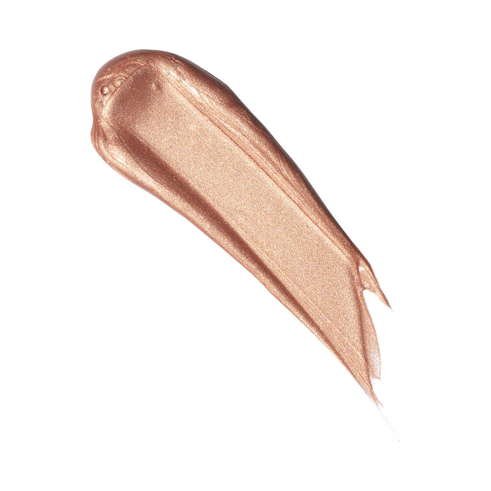 Textura cremosa e brilhante do Iluminador Líquido Payot Gold em tom dourado metálico