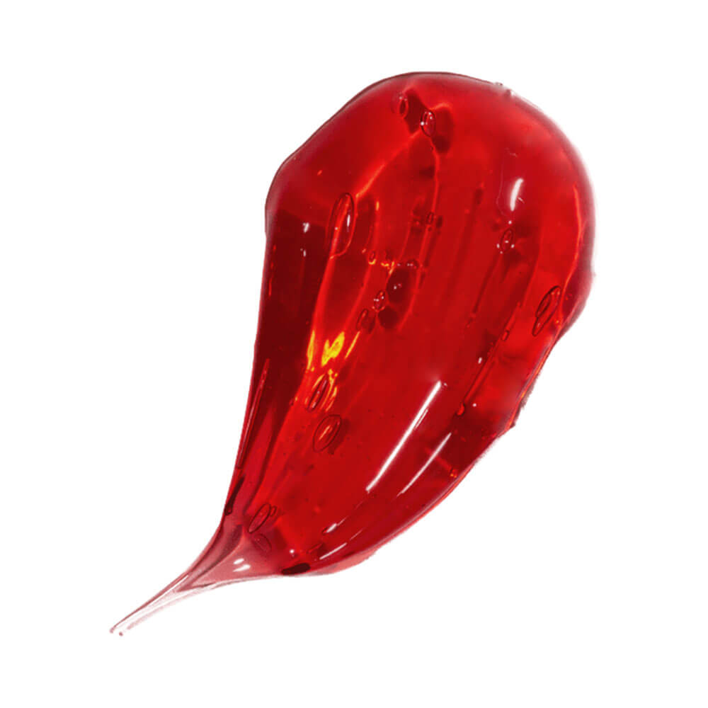 Gota do Lip Oil Dailus Cereja mostrando textura líquida e cor vermelha brilhante