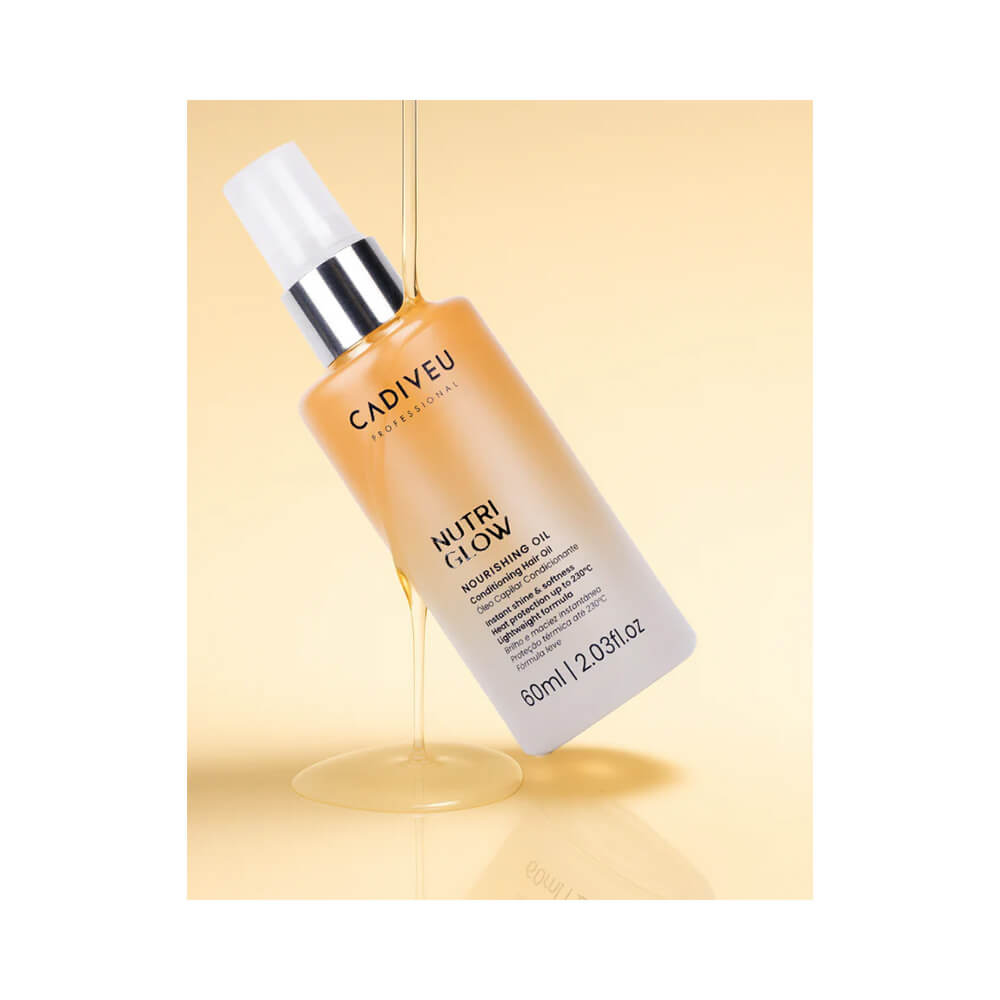 Óleo capilar Cadiveu Nutri Glow 60ml inclinado com óleo fluido escorrendo em fundo amarelo suave