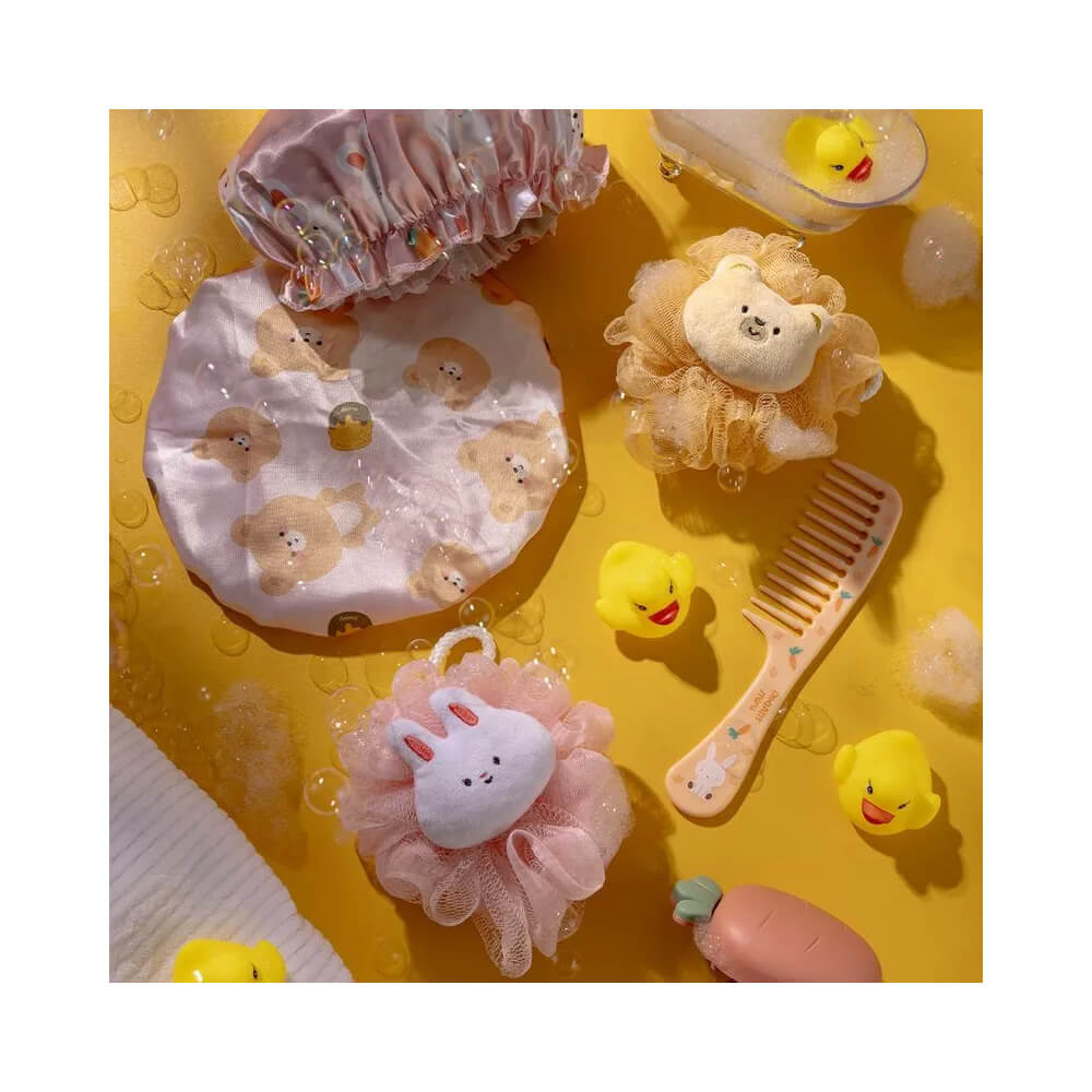 Esponja de banho Proart Mini Coelho rosa claro com espuma e bolhas em ambiente de banho