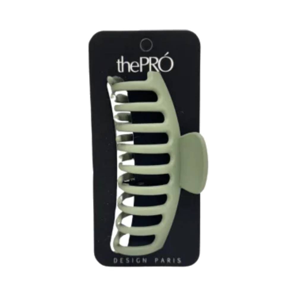 Prendedor verde fosco da marca thePRÓ fixado em embalagem preta com texto branco.